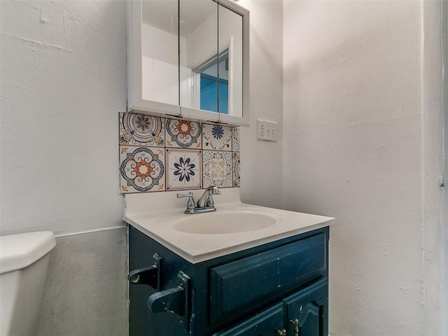 650 NW 5th St, Moore, OK 73160 - bathroom featuring vanity and decorative backsplash