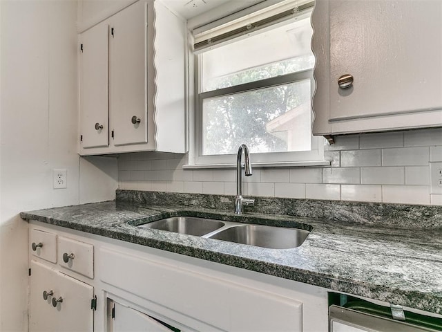 650 NW 5th St, Moore, OK 73160 - kitchen featuring white cabinets, decorative backsplash, and dishwasher