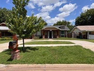 1727 NW 31st St, Oklahoma City, OK 73118 - view of front facade with concrete driveway and a front lawn