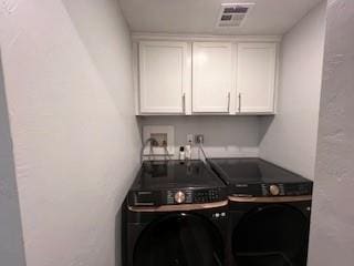 1727 NW 31st St, Oklahoma City, OK 73118 - washroom featuring washer and dryer and cabinet space
