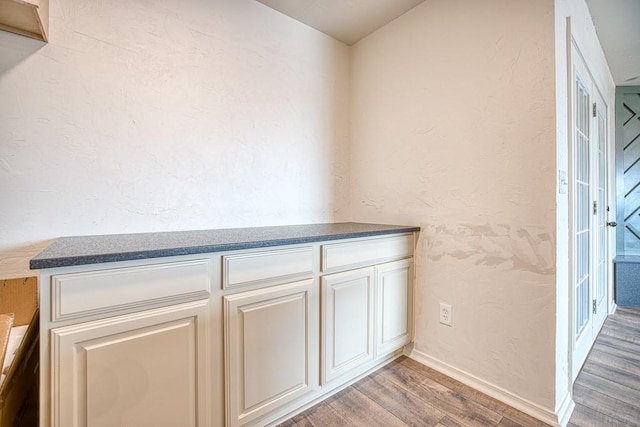 1212 S Main St, Kingfisher, OK 73750 - detailed view of wood finished floors and baseboards