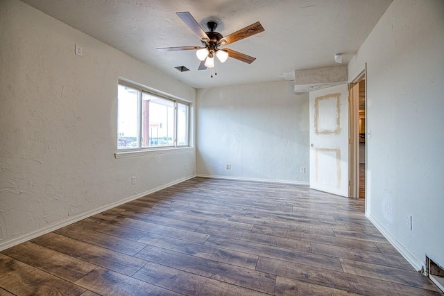 1212 S Main St, Kingfisher, OK 73750 - spare room featuring a ceiling fan and hardwood / wood-style flooring