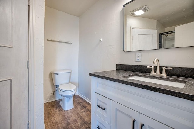 1212 S Main St, Kingfisher, OK 73750 - full bathroom with vanity and wood finished floors