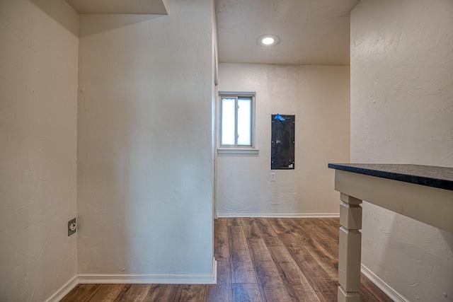 1212 S Main St, Kingfisher, OK 73750 - corridor with wood finished floors and a textured wall