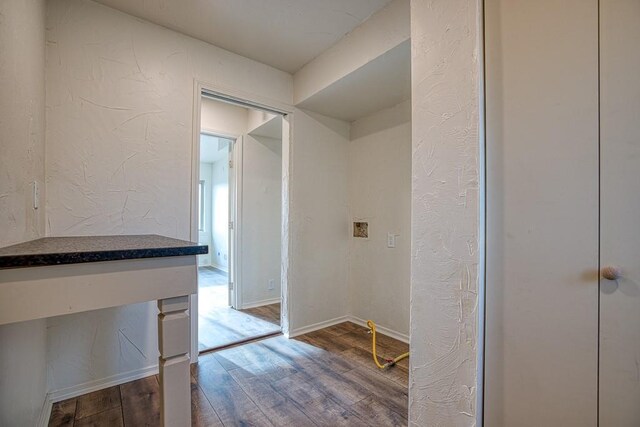 1212 S Main St, Kingfisher, OK 73750 - hallway with wood finished floors and a textured wall