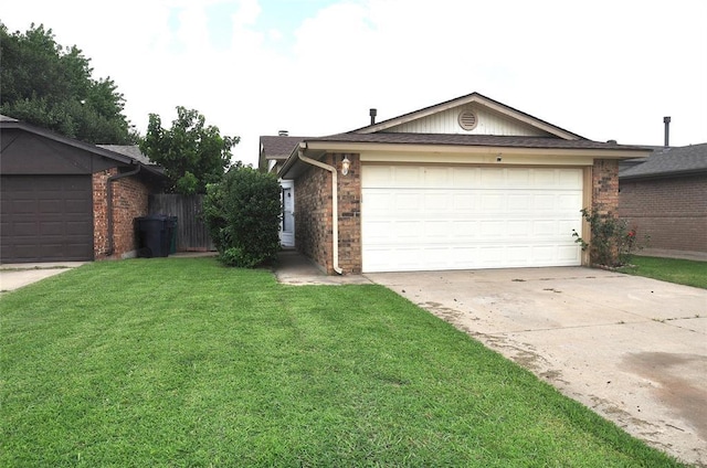 1333 SW 95th St, Oklahoma City, OK 73159 - ranch-style house with concrete driveway, brick siding, and a garage