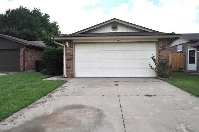 1333 SW 95th St, Oklahoma City, OK 73159 - single story home featuring concrete driveway, a front yard, and a garage