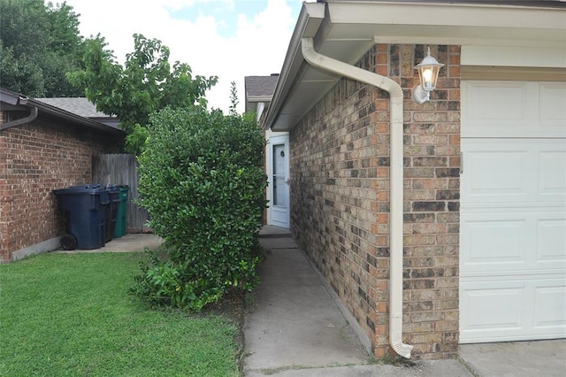 1333 SW 95th St, Oklahoma City, OK 73159 - view of exterior entry with brick siding and an attached garage