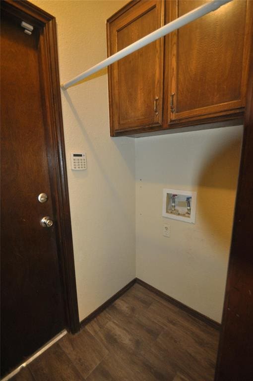 1333 SW 95th St, Oklahoma City, OK 73159 - laundry area with hookup for a washing machine, dark wood-type flooring, and cabinet space