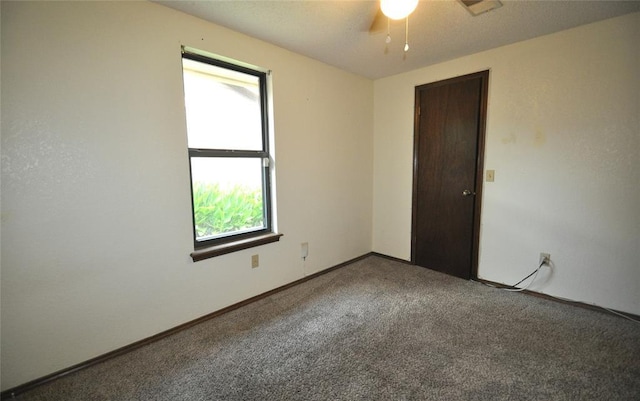 1333 SW 95th St, Oklahoma City, OK 73159 - carpeted empty room featuring healthy amount of natural light and a ceiling fan