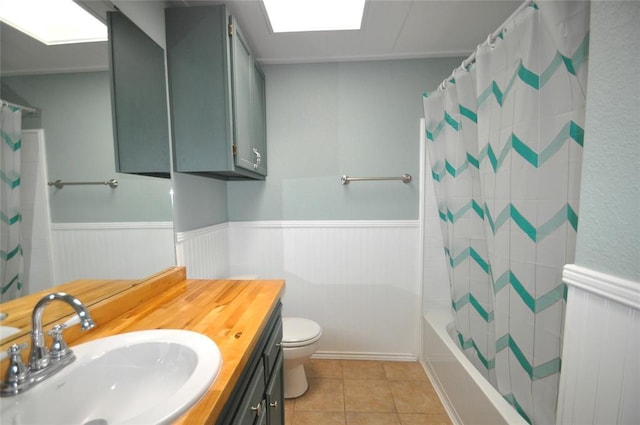 1333 SW 95th St, Oklahoma City, OK 73159 - bathroom with a wainscoted wall, vanity, tile patterned floors, and shower / tub combo