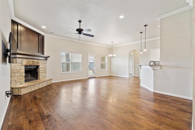 28 143rd St, Oklahoma City, OK 73170 - unfurnished living room with ceiling fan, a fireplace, wood finished floors, ornamental molding, and recessed lighting