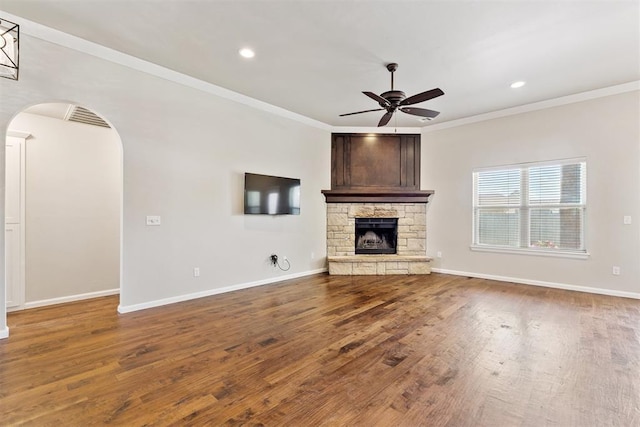 28 143rd St, Oklahoma City, OK 73170 - unfurnished living room with ceiling fan, wood finished floors, crown molding, recessed lighting, and arched walkways