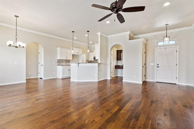 28 143rd St, Oklahoma City, OK 73170 - unfurnished living room with arched walkways, ornamental molding, ceiling fan, a chandelier, and recessed lighting