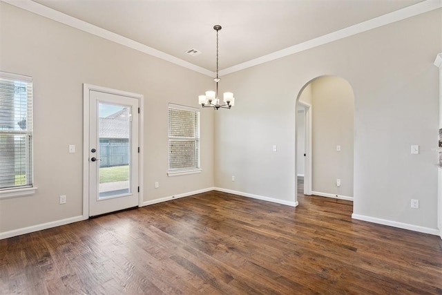 28 143rd St, Oklahoma City, OK 73170 - unfurnished room with arched walkways, crown molding, plenty of natural light, a chandelier, and dark wood finished floors
