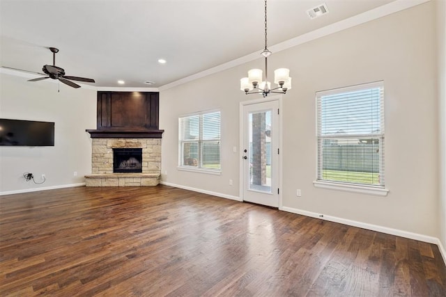 28 143rd St, Oklahoma City, OK 73170 - unfurnished living room featuring a chandelier, dark wood-style flooring, a stone fireplace, a ceiling fan, and recessed lighting
