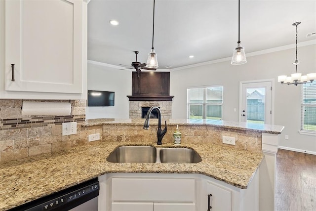 28 143rd St, Oklahoma City, OK 73170 - kitchen featuring dishwasher, ceiling fan, wood finished floors, ornamental molding, and backsplash