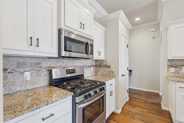 28 143rd St, Oklahoma City, OK 73170 - kitchen with stainless steel appliances, decorative backsplash, white cabinetry, light stone countertops, and recessed lighting