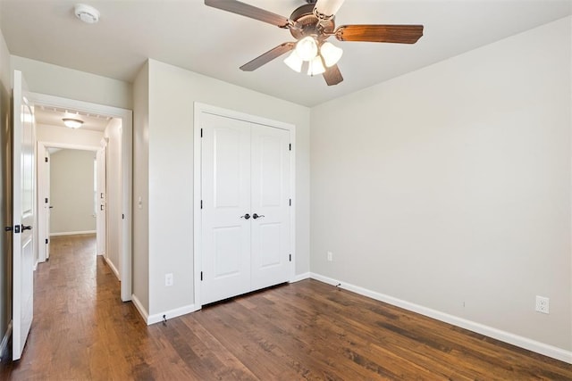 28 143rd St, Oklahoma City, OK 73170 - unfurnished bedroom featuring dark wood-style flooring, a closet, and a ceiling fan