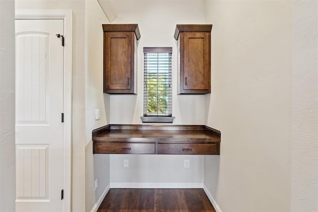 28 143rd St, Oklahoma City, OK 73170 - kitchen featuring dark wood-type flooring and brown cabinetry