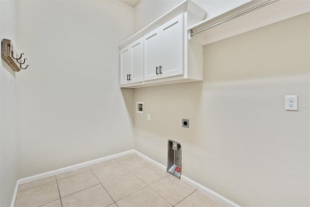28 143rd St, Oklahoma City, OK 73170 - washroom featuring cabinet space, washer hookup, light tile patterned floors, and hookup for an electric dryer