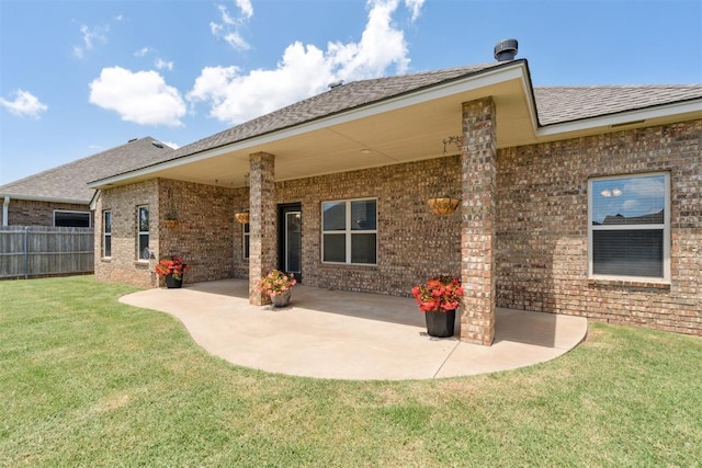 28 143rd St, Oklahoma City, OK 73170 - rear view of property with brick siding, a patio area, and a shingled roof
