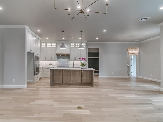 6104 NW 147th Ter, Oklahoma City, OK 73142 - kitchen featuring appliances with stainless steel finishes, a chandelier, decorative backsplash, light wood finished floors, and recessed lighting