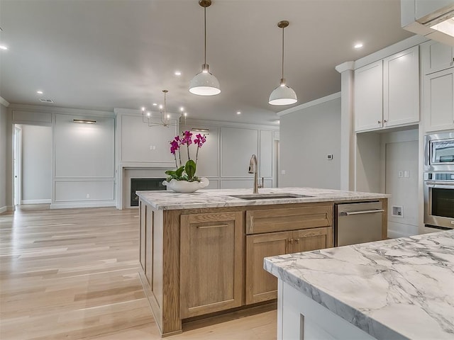 6104 NW 147th Ter, Oklahoma City, OK 73142 - kitchen with stainless steel appliances, crown molding, light wood-type flooring, light stone countertops, and recessed lighting