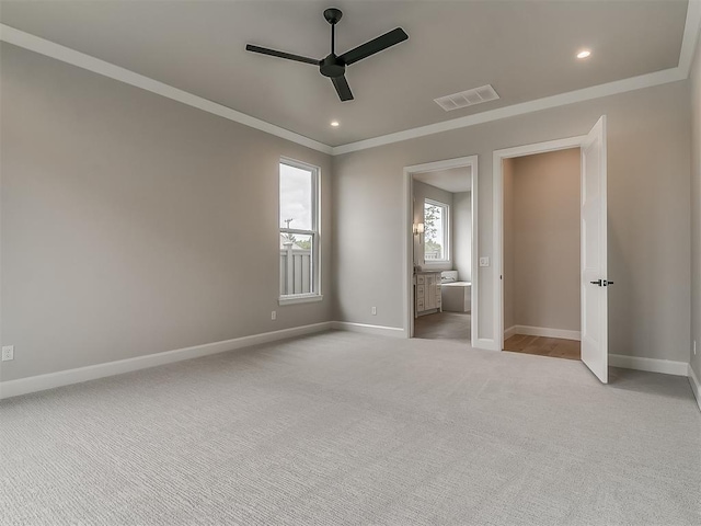 6104 NW 147th Ter, Oklahoma City, OK 73142 - unfurnished bedroom with crown molding, light colored carpet, recessed lighting, ceiling fan, and ensuite bath