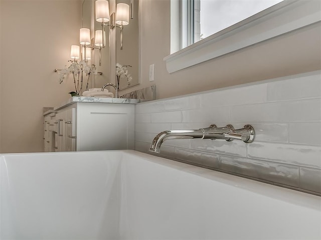 6104 NW 147th Ter, Oklahoma City, OK 73142 - bathroom view of vanity and a bath