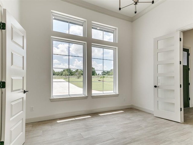 2261 Winter Creek Blvd, Blanchard, OK 73010 - unfurnished room featuring ornamental molding and light wood-type flooring