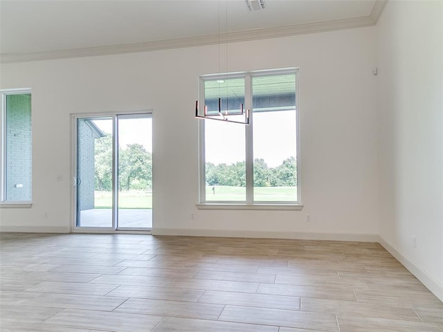 2261 Winter Creek Blvd, Blanchard, OK 73010 - spare room featuring ornamental molding and wood tiled floors