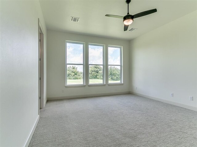 2261 Winter Creek Blvd, Blanchard, OK 73010 - spare room with carpet and a ceiling fan