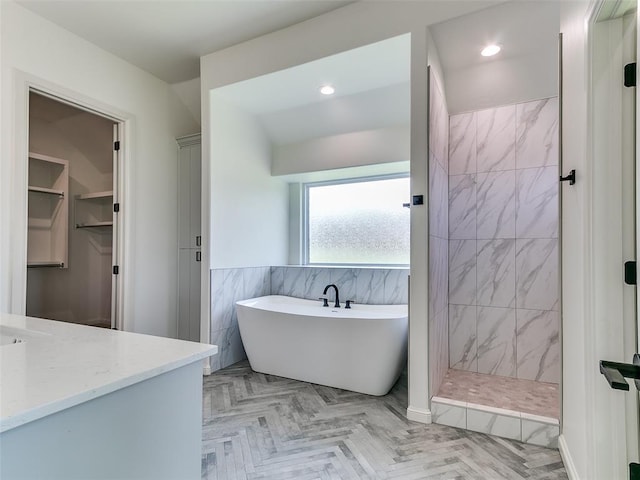 2261 Winter Creek Blvd, Blanchard, OK 73010 - bathroom with a freestanding bath, walk in shower, vanity, recessed lighting, and a spacious closet
