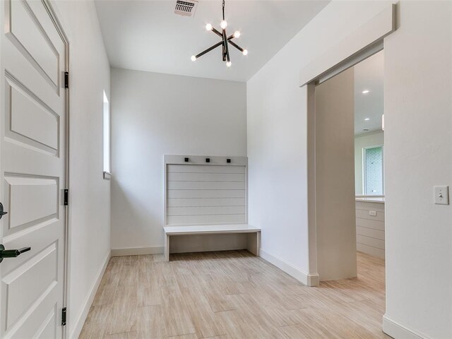 2261 Winter Creek Blvd, Blanchard, OK 73010 - mudroom featuring a chandelier and wood finished floors