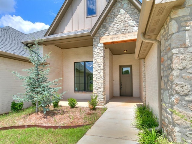 2263 Winter Creek Blvd, Blanchard, OK 73010 - entrance to property with board and batten siding, stone siding, brick siding, and a shingled roof