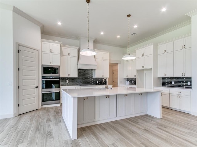 2263 Winter Creek Blvd, Blanchard, OK 73010 - kitchen with double oven, built in microwave, a spacious island, backsplash, and light countertops