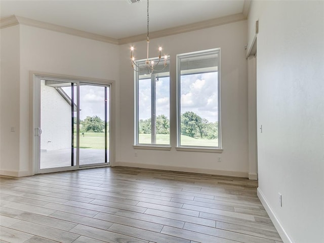 2263 Winter Creek Blvd, Blanchard, OK 73010 - spare room with a chandelier, light wood finished floors, and crown molding