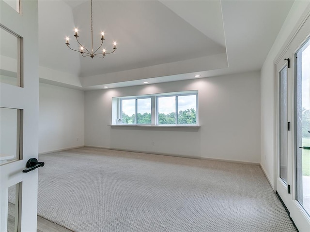 2263 Winter Creek Blvd, Blanchard, OK 73010 - spare room featuring light carpet, a chandelier, and recessed lighting
