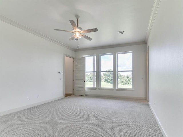 2263 Winter Creek Blvd, Blanchard, OK 73010 - spare room with crown molding, light colored carpet, and ceiling fan