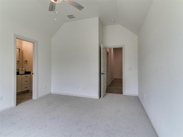 2263 Winter Creek Blvd, Blanchard, OK 73010 - unfurnished bedroom featuring vaulted ceiling, light carpet, connected bathroom, and a ceiling fan