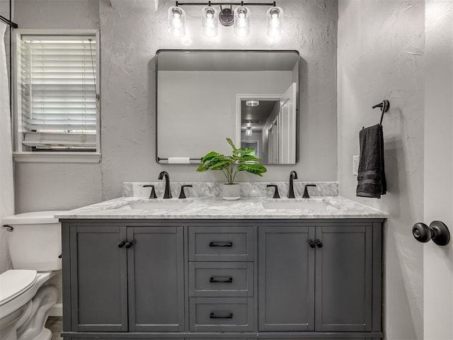 313 Ember Glow Dr, Moore, OK 73160 - full bath featuring double vanity and a textured wall