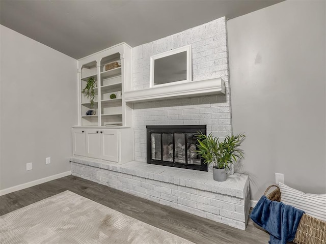 313 Ember Glow Dr, Moore, OK 73160 - living area featuring wood finished floors and a fireplace