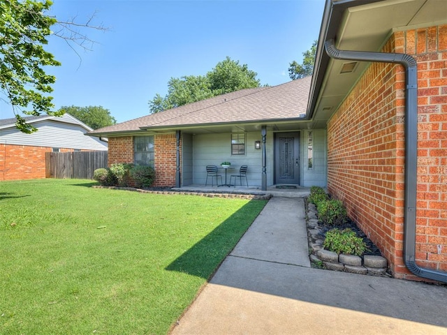 313 Ember Glow Dr, Moore, OK 73160 - property entrance with brick siding and a porch