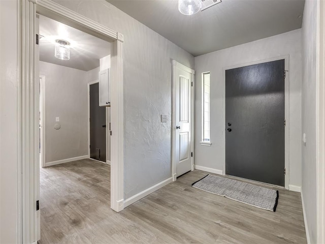 313 Ember Glow Dr, Moore, OK 73160 - foyer entrance with light wood-style floors