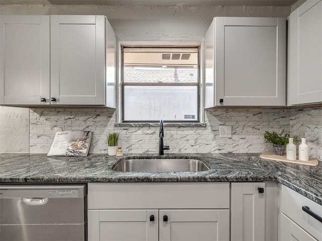 313 Ember Glow Dr, Moore, OK 73160 - kitchen featuring dishwasher, tasteful backsplash, and white cabinetry