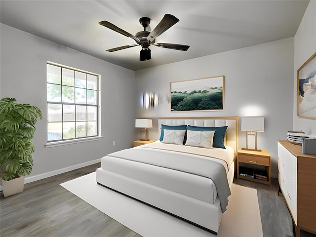 313 Ember Glow Dr, Moore, OK 73160 - bedroom with wood finished floors and a ceiling fan