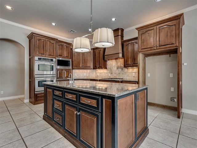 1233 Autumn Creek Dr, Edmond, OK 73003 - kitchen with stainless steel appliances, dark stone countertops, light tile patterned floors, tasteful backsplash, and crown molding