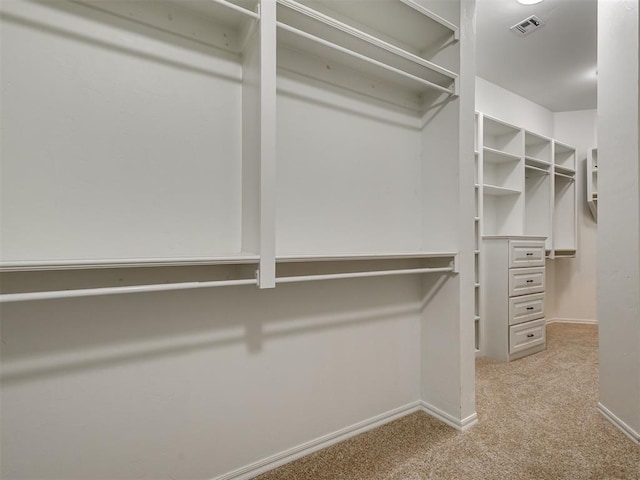 1233 Autumn Creek Dr, Edmond, OK 73003 - walk in closet with carpet flooring