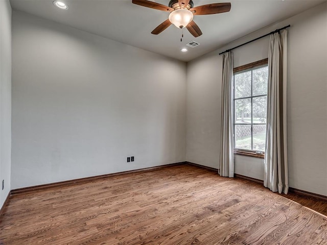 1233 Autumn Creek Dr, Edmond, OK 73003 - empty room featuring healthy amount of natural light, light wood-style flooring, ceiling fan, and recessed lighting